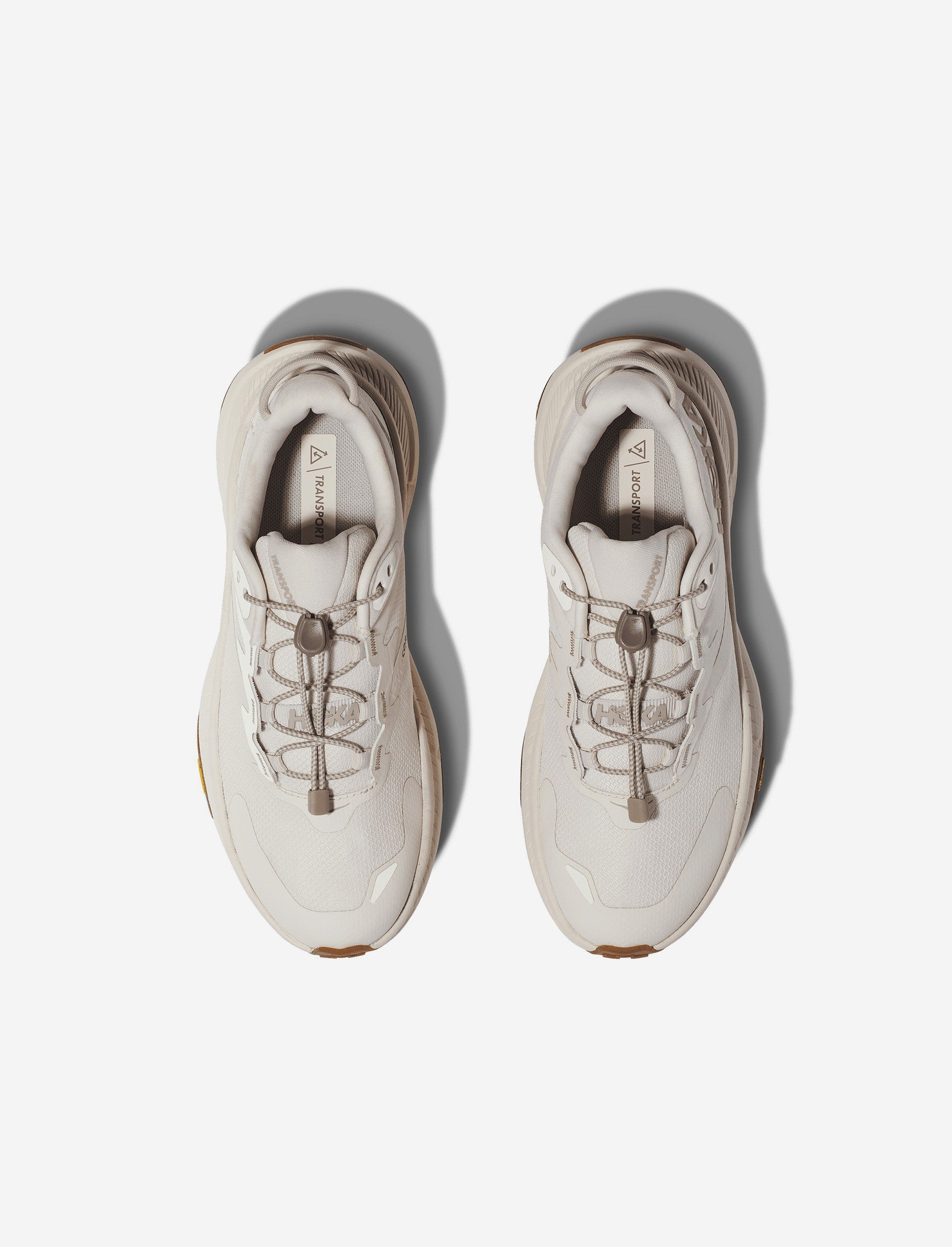 Hoka Transport - נעלי הליכה נשים הוקה טרנספורט בצבע לבן צהבהב/לבן צהבהב